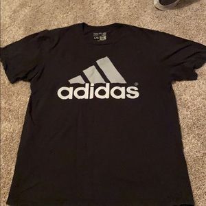 black Adidas tee.